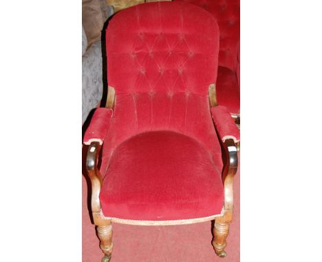 An early Victorian rosewood framed and red button back upholstered open armchair, raised on turned and tapering forelegs to b