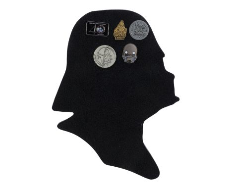 STAR WARS: THE COMPLETE SAGA (1976-PRESENT) - Crew Pins on Darth Vader Silhouette - A set of crew pins on a Darth Vader silho