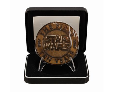 STAR WARS: VARIOUS PRODUCTIONS - Anthony Daniels Collection: Lucasfilm 10 Year Anniversary Coin and Stand - A Lucasfilm 10-ye