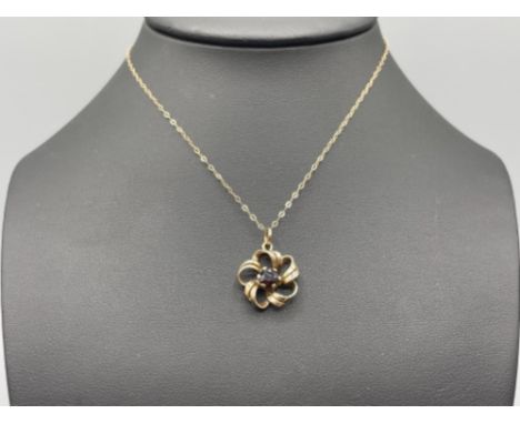Ladies 9ct gold ruby pendant and chain.