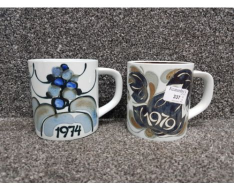 2 royal copenhagen annual mugs with solid silver ingot to base 1974 and1979 handle damage repaired