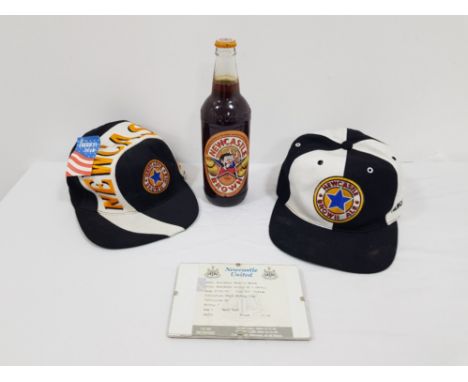 A pair of Newcastle brown ale caps together with a bottle of Newcastle brown ale with viz character and framed Peter beardsle