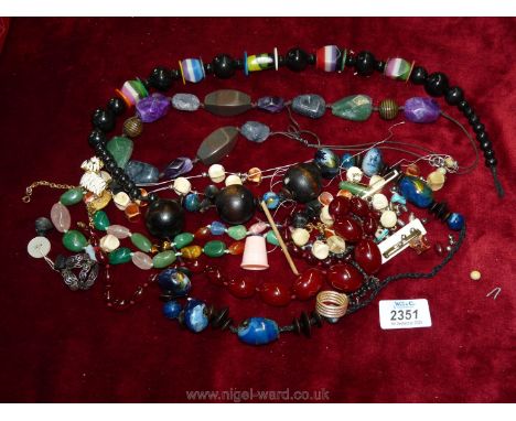 A quantity of costume jewellery including bead necklaces, scarf ring etc.