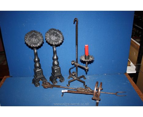 A quantity of metalware including large sunflower fire dogs, ornamental toasting fork, etc.