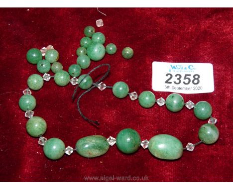 A string (broken) of 27 Jade coloured beads and faceted glass beads for re-stringing.