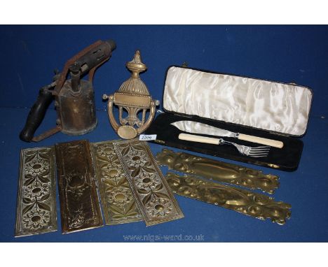 A quantity of brass including blow lamp, cased fish eaters, brass knocker and six brass door finger plates etc.