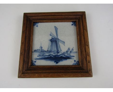 A framed Delftware tile 
