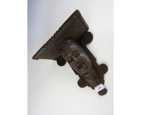 A carved oak shelf bracket after the antique