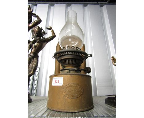 A wall mounted oil lamp