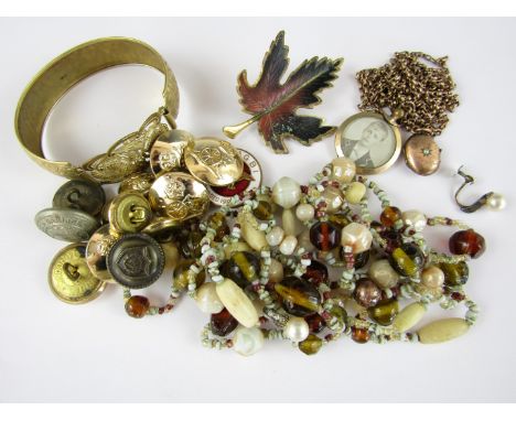 A quantity of vintage costume jewellery including a rolled gold guard chain with locket, bangle and Wildflowers Association o