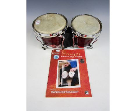 A pair of Stagg bongos and an accompanying booklet