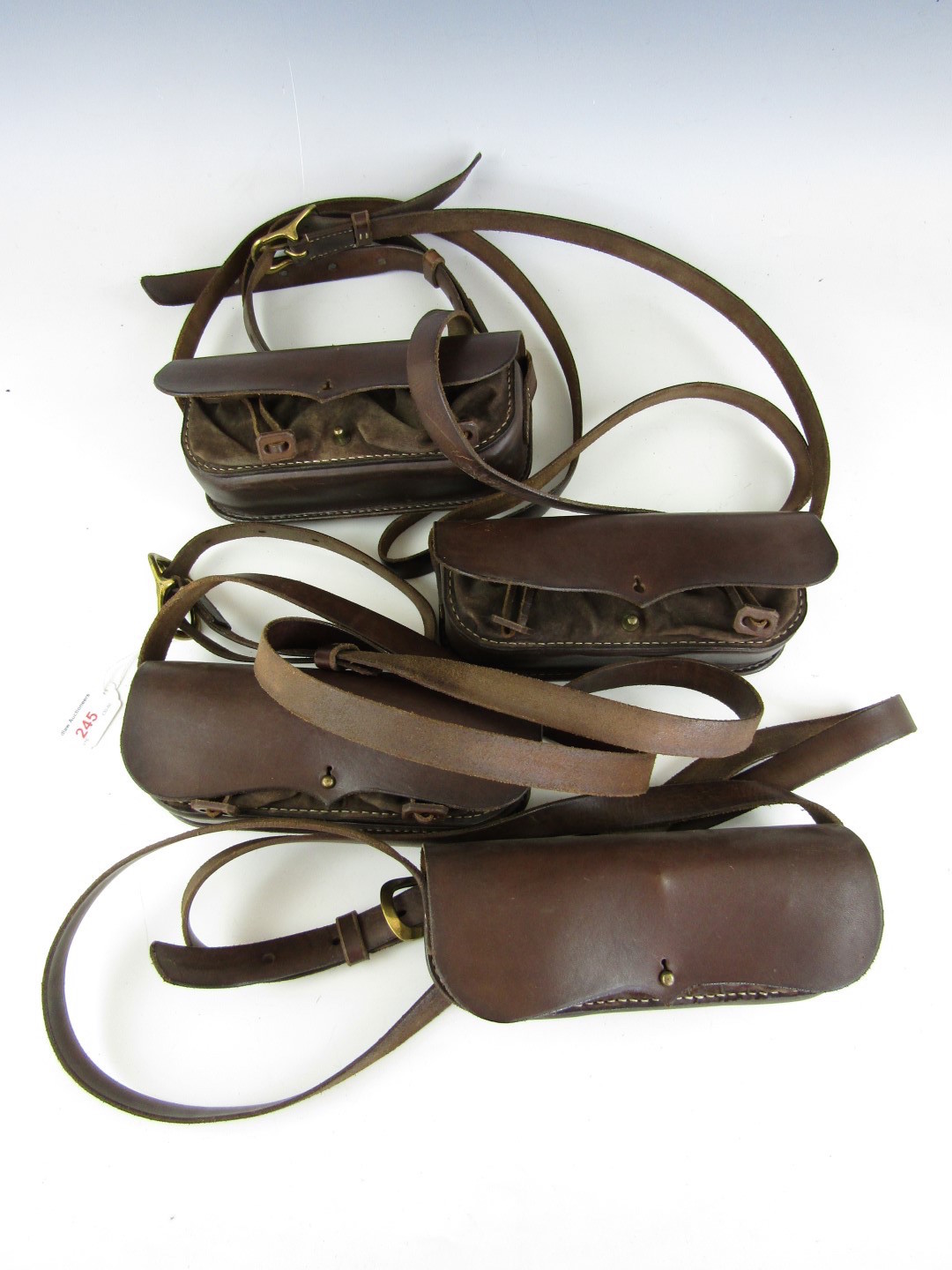 Four reproduction 18th Century cartridge pouches with shoulder belts