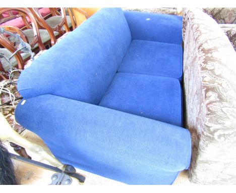 A contemporary electric blue two seater sofa bed 