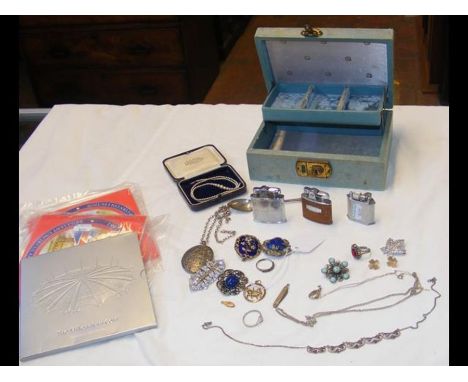 An antique enamel and seed pearl brooch, together with vintage lighters and collectable coins CONDITION REPORTAS PER IMAGES