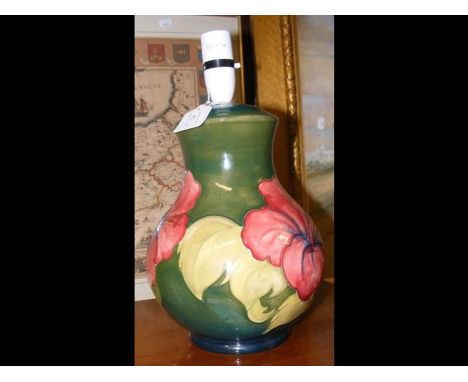 A Moorcroft Pottery table lamp - 25cms high with label to the base