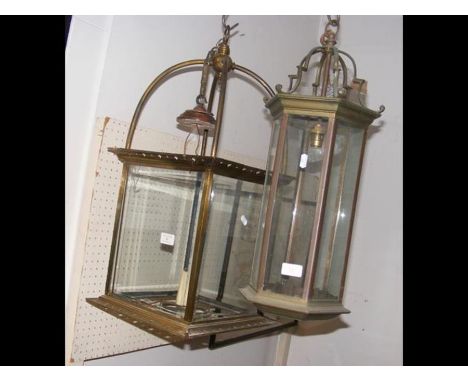A decorative brass and glass porch lamp and one other