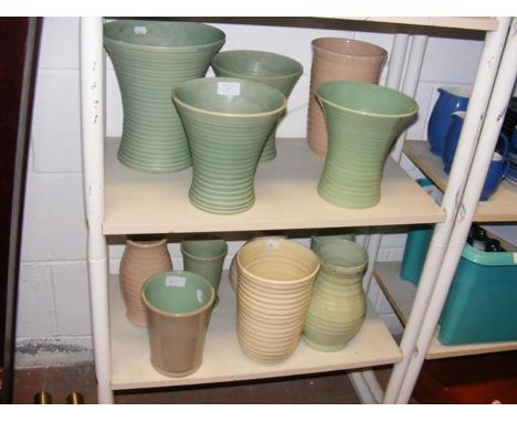 A collection of ceramic glass vases, including Denby stoneware - on two shelves 