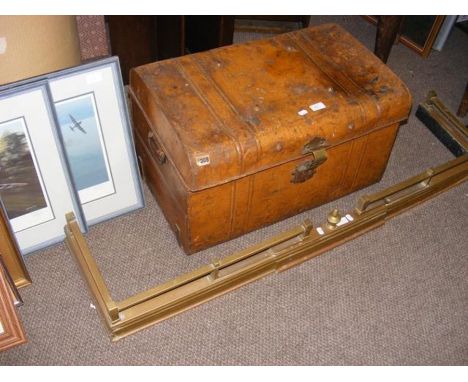 A metal trunk containing vintage scales, together with a brass fire fender 