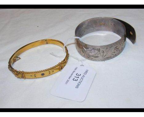 A 9ct gold bangle, together with a silver bangle 