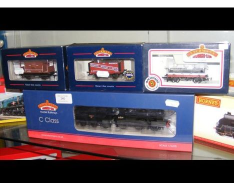 A boxed Bachmann locomotive and tender, together with three boxed wagons