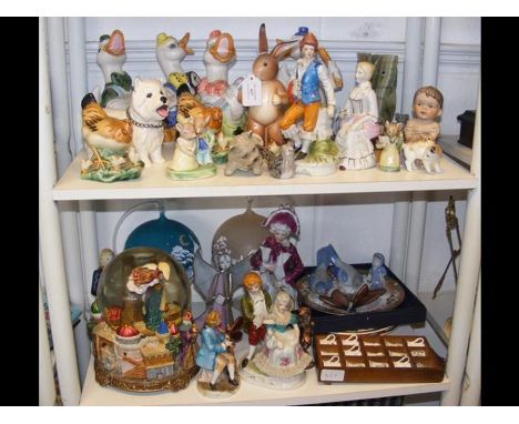 Two shelves of collectable ceramic figurines, etc. 