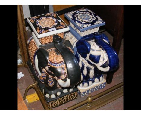 A ceramic elephant garden ornament and one other