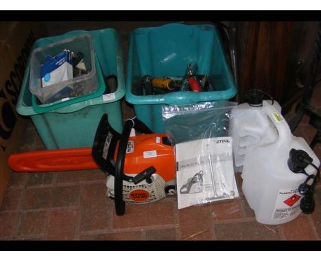 A petrol driven Stihl chainsaw with fuel can