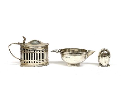 Three silver items: lidded mustard with blue glass liner; small pap boat; and an egg shaped pepper, gross weight 176g (3) 