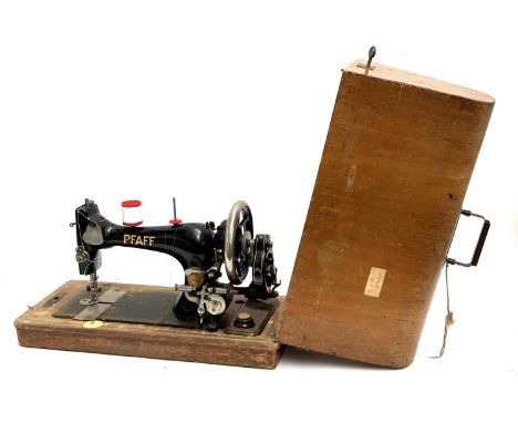 A vintage oak cased Pfaff sewing machine 