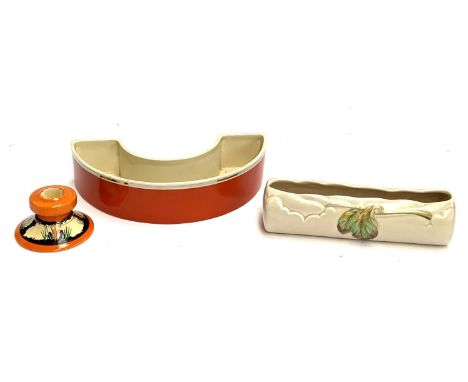 A Clarice Cliff Bizarre Newport Pottery crocus pattern candlestick, together with a Clarice Cliff Newport pottery posy trough