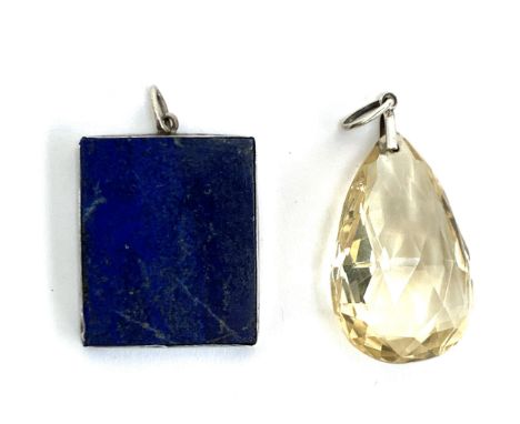An Art Deco faceted citrine drop pendant with articulated bale, the drop 4cmL; together with a white metal mounted lapis lazu