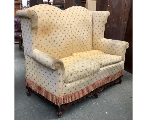Interior design interest: A Victorian high wingback two seater sofa, with a carved mahogany frieze, 175cmW 
