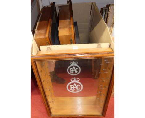 Three wall mounted glazed display cabinets, each with glass shelves, one annotated for the AA and one for the RAC, each full 