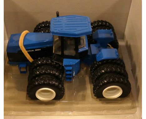 An RC2 boxed 1/32 scale modern issue model of a No. 9884 New Holland 4WD tractor