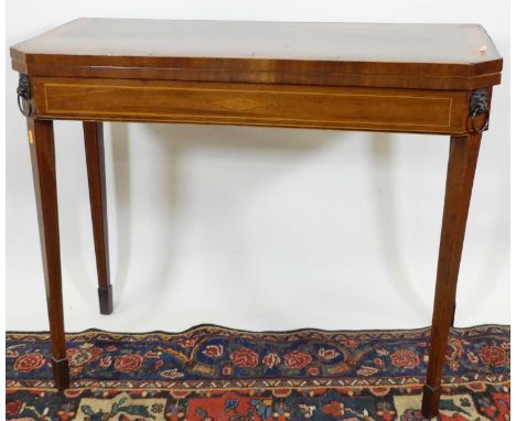 A Regency mahogany, satinwood and rosewood crossbanded fold over card table, having a baize lined interior, rear gate leg act