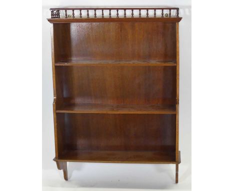 An Edwardian mahogany and satinwood inlaid three tier hanging wall shelf, width 63cm