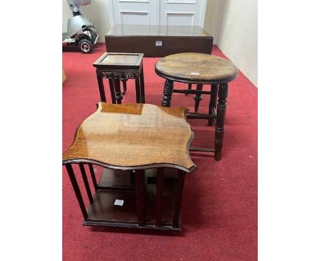 A Victorian mahogany commode stool, together with a mahogany table top revolving bookcase, fruitwood work stool and a small C