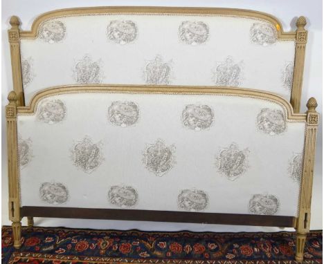 An early 20th century provincial French cream painted double lit-en-bateau, with later classical style fabric inset upholster