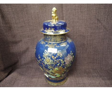 A Carltonware lidded jar having pictorial gilt heightened bleu royale decoration with Dog of Foe finial