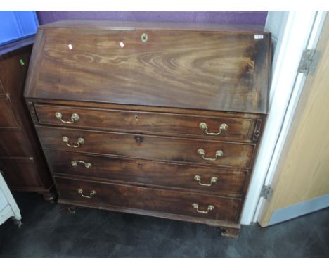 An early 19th century mahogany bureau having fall flap and fitted interior over 4 long graduated drawers and bracket feet