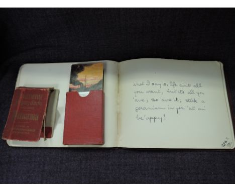 A vintage autograph album having early 20th script and illustrations and a set of vintage Panama playing cards