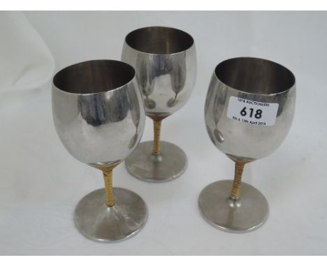 Three stainless steel goblets by Viners designed by Stuart Devlin