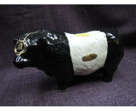 A Rutherfords Scotch Whisky ceramic decanter modelled as a Belted Galloway Bull