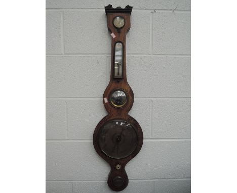 A 19th century mahogany barometer having silvered dial with thermometer scale