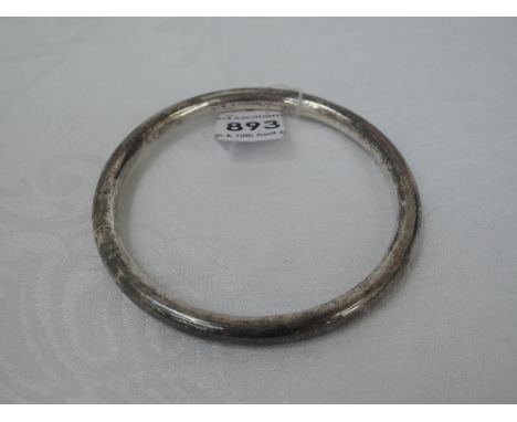 A silver bangle of plain tubular form, Chester 1921, Charles Horner inner diameter is 7cm