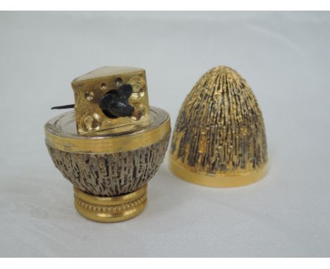 A cased Stuart Devlin 1972 silver gilt limited edition surprise Easter egg having a textured exterior opening to reveal a tre