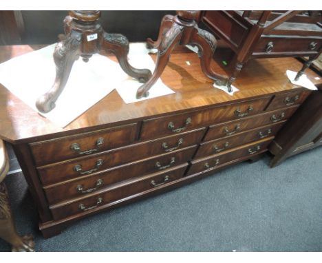 A late 20th century mahogany Regency inspired sideboard having 3 frieze and 6 short drawers on bracket base