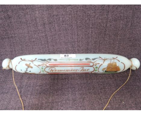 A Victorian opaque glass rolling pin having pictorial decoration and script, 'Remember Me'Used condition