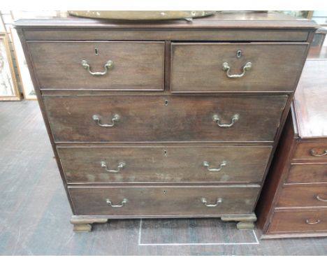 An early 19th century mahogany chest of 2 short and 3 long cockbeaded drawers on bracket feet