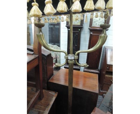 A mid 20th century brass standard lamp of scroll and reeded Empire design